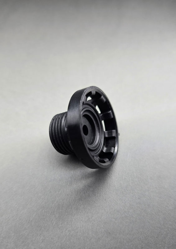 Ausspindelmechanismus Schwarzes Kunststoffteil mit präzise ausgearbeitetem Gewinde, gefertigt mittels Ausspindeltechnik. Hersteller Fertigung Produzent Leiferant Schnitzler Kunststofftechnik in Küps bei Kronach, Region Oberfranken, Bayern, Deutschland